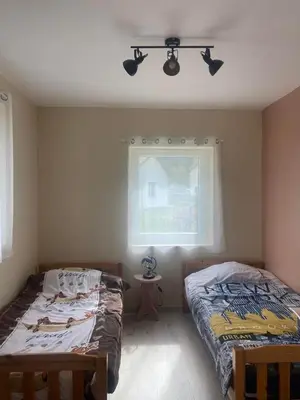 Un ou plusieurs lits dans un hébergement de l'établissement Gîte Auberge du fumoir