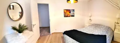 Un ou plusieurs lits dans un hébergement de l'établissement Petite Venise Grand Duplex Turenne Hyper Centre