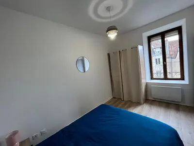Un ou plusieurs lits dans un hébergement de l'établissement Appartement centre-ville de Lure gauche