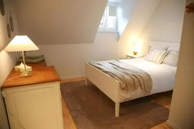 Un ou plusieurs lits dans un hébergement de l'établissement Villa Camélias, appartements de Charme