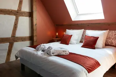Un ou plusieurs lits dans un hébergement de l'établissement Domaine La Grange Ungersheim - Chambres d'Hôtes L'Inspiration