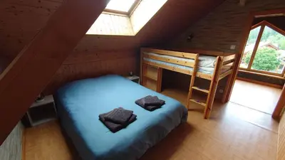 Un ou plusieurs lits dans un hébergement de l'établissement Grand Appartement à Gerardmer