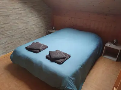 Un ou plusieurs lits dans un hébergement de l'établissement Grand Appartement à Gerardmer