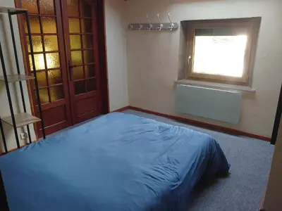 Un ou plusieurs lits dans un hébergement de l'établissement Grand Appartement à Gerardmer