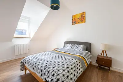 Un ou plusieurs lits dans un hébergement de l'établissement La Maison de maître - centre historique - 3 rue henriette