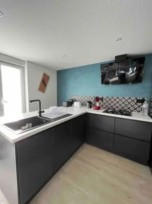 Cuisine ou kitchenette dans l'établissement Gîte des douze mulets