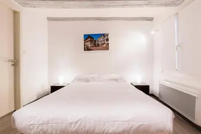 Un ou plusieurs lits dans un hébergement de l'établissement Historic city center - Petite Venise suites