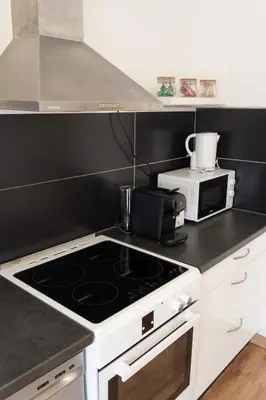 Cuisine ou kitchenette dans l'établissement Le Luma