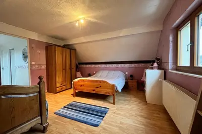 Un ou plusieurs lits dans un hébergement de l'établissement Appartement indépendant à proximité de belfort