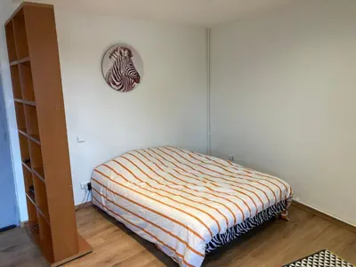 Un ou plusieurs lits dans un hébergement de l'établissement Studio fonctionnel, étage 2, proche Techn'hom, IUT et UTBM