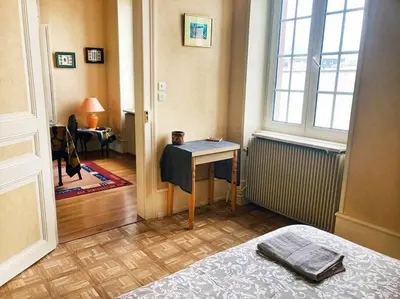Un ou plusieurs lits dans un hébergement de l'établissement Charmant T3 proche du centre-ville