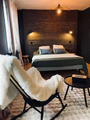 Un ou plusieurs lits dans un hébergement de l'établissement Maison Les Planches