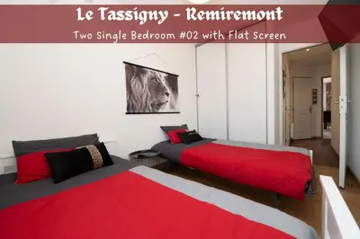 Un ou plusieurs lits dans un hébergement de l'établissement Le Tassigny 3 étoiles - Hyper-Centre Balneo Wifi Parking