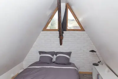 Un ou plusieurs lits dans un hébergement de l'établissement charmant appartement alsacien