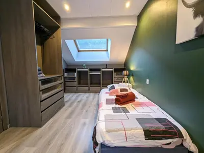 Un ou plusieurs lits dans un hébergement de l'établissement Maison Gite Le Bressaud