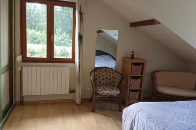 Un ou plusieurs lits dans un hébergement de l'établissement Charmante Maison Blanche