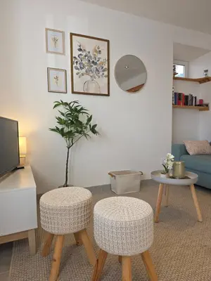 Télévision ou salle de divertissement dans l'établissement Appartement Les Géraniums