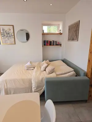 Un ou plusieurs lits dans un hébergement de l'établissement Appartement Les Géraniums