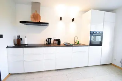 Cuisine ou kitchenette dans l'établissement Vacances au Bonhomme