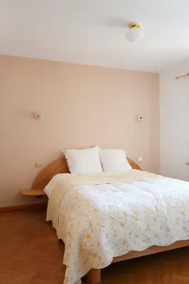 Un ou plusieurs lits dans un hébergement de l'établissement Chez Mamama, gîte cosy sur la route des vins