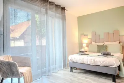Un ou plusieurs lits dans un hébergement de l'établissement Ma Préférence - Studio Cozy - Parking Gratuit - Proche Commerces & Transports