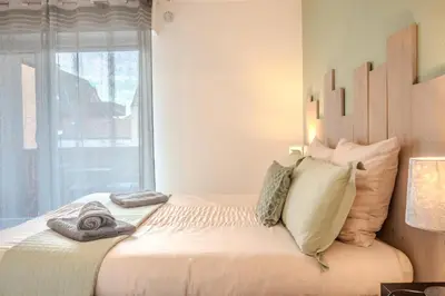 Un ou plusieurs lits dans un hébergement de l'établissement Ma Préférence - Studio Cozy - Parking Gratuit - Proche Commerces & Transports