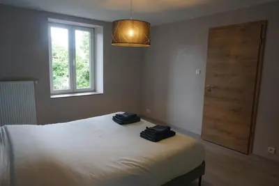 Un ou plusieurs lits dans un hébergement de l'établissement L'Aubach - appartement spacieux - au pied du vignoble - parking gratuit