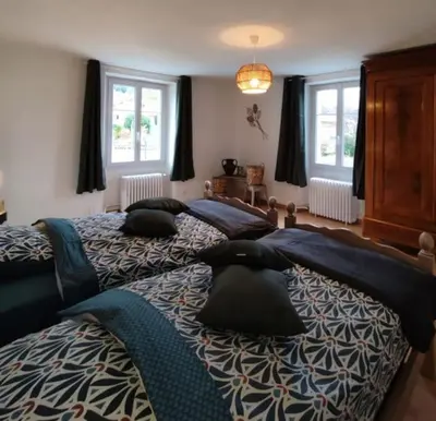 Un ou plusieurs lits dans un hébergement de l'établissement Gîte cosy avec avec jardin et parking privatifs - Hautes Vosges