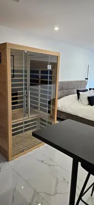 Un ou plusieurs lits dans un hébergement de l'établissement Loft Détente & Spa du Tram