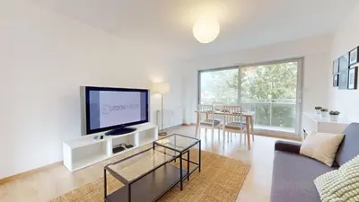 Télévision ou salle de divertissement dans l'établissement Appartement La Fecht + parking