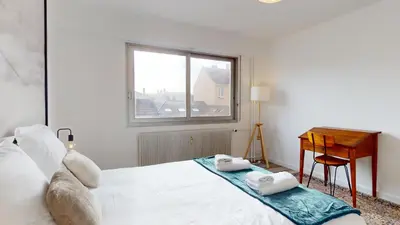 Un ou plusieurs lits dans un hébergement de l'établissement Appartement La Fecht + parking