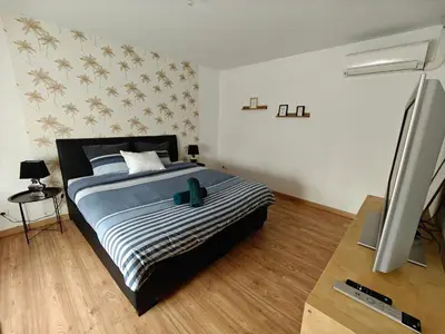 Un ou plusieurs lits dans un hébergement de l'établissement Chambre climatisée et cosy Auberge du manala Hôtel 24 24