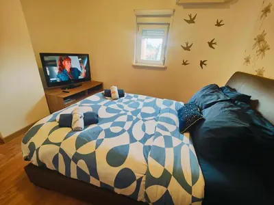 Un ou plusieurs lits dans un hébergement de l'établissement Chambre climatisée et cosy Auberge du manala Hôtel 24 24