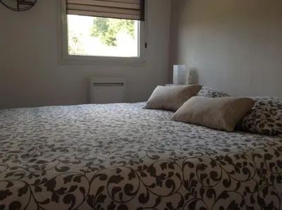 Un ou plusieurs lits dans un hébergement de l'établissement La Maison Bleue