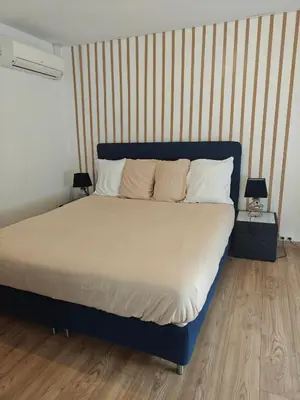Un ou plusieurs lits dans un hébergement de l'établissement Chambre climatisée cosy Auberge du Manala Hôtel 24-24