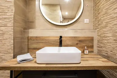Salle de bains dans l'établissement Appartement 12 personnes 4 suite privatives 160 m2 terrasse