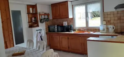 Cuisine ou kitchenette dans l'établissement Appartement cosy à Bussang