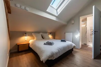 Un ou plusieurs lits dans un hébergement de l'établissement Hôtel du DOMAINE SAINT LOUP