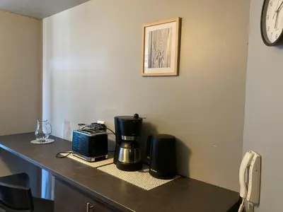 Cuisine ou kitchenette dans l'établissement LE CONTI