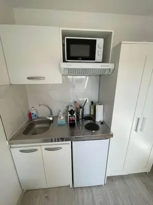 Cuisine ou kitchenette dans l'établissement Esprit Beige - Joli Studio Salengro - Sauna & Sport club