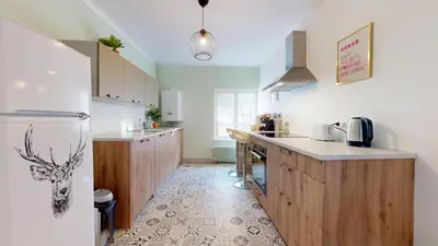 Cuisine ou kitchenette dans l'établissement Le Petit Chez Vous