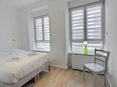 Un ou plusieurs lits dans un hébergement de l'établissement Maison de caractère avec jacuzzi et parking à deux pas du centre historique de Colmar - FR-1-722-3