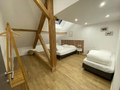 Un ou plusieurs lits dans un hébergement de l'établissement Gîte 14 personnes - 10 minutes de Gerardmer - Jaccuzzi