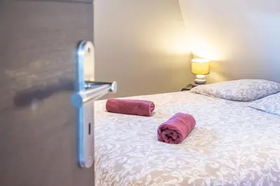 Un ou plusieurs lits dans un hébergement de l'établissement Appartement cosy et spacieux, 4 ch, parking - centre - Les Vieux Toits de Riquewihr