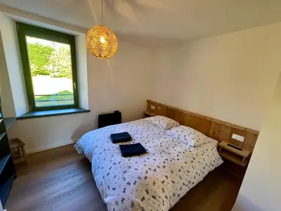 Un ou plusieurs lits dans un hébergement de l'établissement Superbe appartement neuf avec Sauna privé & Terrasse vue sur la montagne
