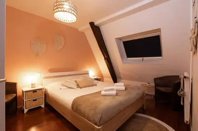 Un ou plusieurs lits dans un hébergement de l'établissement La Loge by 