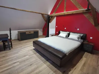 Un ou plusieurs lits dans un hébergement de l'établissement Gîte SPA de la Hardt - Jacuzzi intérieur privé