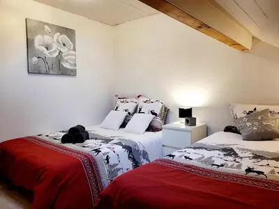 Un ou plusieurs lits dans un hébergement de l'établissement Cottage le Ni-La