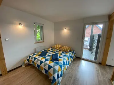 Un ou plusieurs lits dans un hébergement de l'établissement Duplex tout confort, 2 min de Colmar, parking gratuit