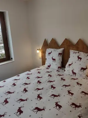 Un ou plusieurs lits dans un hébergement de l'établissement Gîte Papillon 6 à14 personnes - Jacuzzi